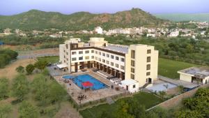 an aerial view of a building with a swimming pool at Bamboo Saa Mulberry Resort Pushkar in Pushkar