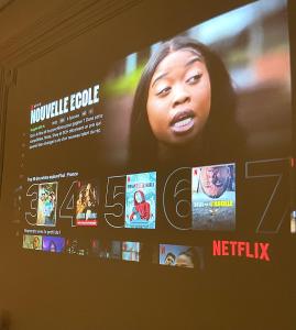 una pantalla de TV con una foto de una mujer en NG SuiteHome - Lille I Roubaix Centre I Collège - Balnéo - Netflix - Wifi, en Roubaix