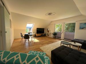 a living room with a couch and a table at Traum Berg - Koppelberg in Traben-Trarbach