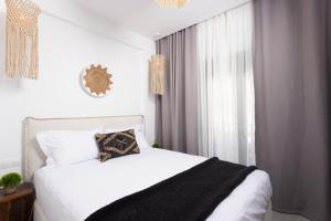 Postel nebo postele na pokoji v ubytování Petra Luxury Suites