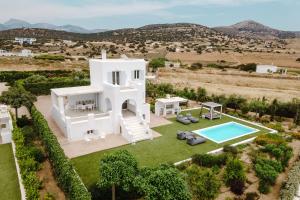 an aerial view of a white villa with a swimming pool at Pyrgaki Beach Villa in Aliko Beach
