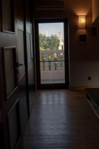 a hallway with a door leading to a balcony at La vue marine II in Burgas