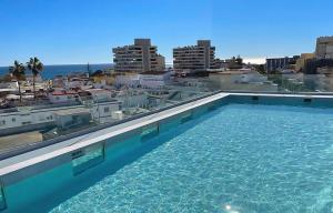 a swimming pool on the roof of a building at Hotel Sireno Torremolinos - Adults Only, Ritual Friendly in Torremolinos