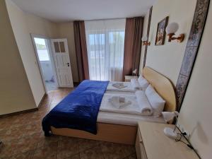 Postel nebo postele na pokoji v ubytování Apartamenty Hexagon nr 24