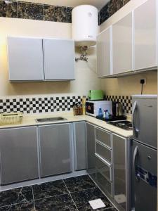 Η κουζίνα ή μικρή κουζίνα στο Quel Serviced Units