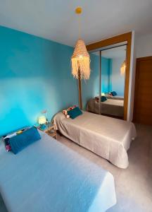Postel nebo postele na pokoji v ubytování Apartamentos Chuita Playa