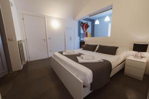 Letto o letti in una camera di Villino Erminia - Seaside Art b&b