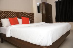 Voodi või voodid majutusasutuse Hotel Nawanagar Residency toas
