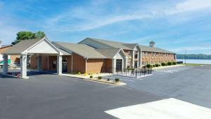 a large parking lot in front of a building at Clarion Pointe on the lake Clarksville-South Hill West in Clarksville