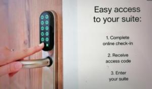 a hand is unlocking a door with a handle at RELAX INN - Messe contactless check in in Hannover