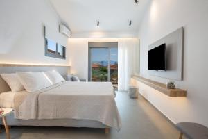 Ένα ή περισσότερα κρεβάτια σε δωμάτιο στο Elianthi Luxury Apartments +58 φωτογραφίες