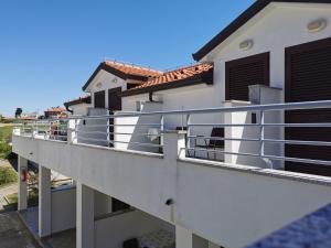 a view of a balcony of a house at Resort Zatišje in Savudrija