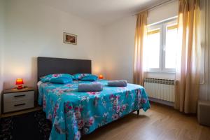 Postel nebo postele na pokoji v ubytování Apartment Jenny with parking, Wi-Fi and sea view