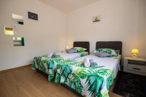 Postel nebo postele na pokoji v ubytování Apartment Jenny with parking, Wi-Fi and sea view