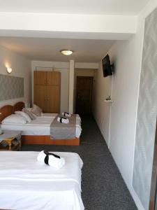 Postel nebo postele na pokoji v ubytování M7 Villa Bed& Bistro