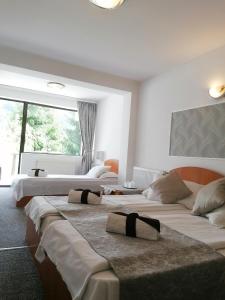 Postel nebo postele na pokoji v ubytování M7 Villa Bed& Bistro