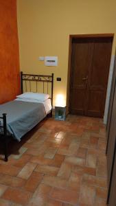 מיטה או מיטות בחדר ב-La Casa dei Nonni