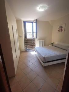 Ένα ή περισσότερα κρεβάτια σε δωμάτιο στο Casa Il Nido