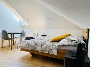 Postel nebo postele na pokoji v ubytování Apartmány v ráji (Českém)