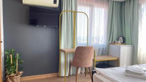 Postel nebo postele na pokoji v ubytování Ora Bella Hotel