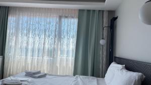 Postel nebo postele na pokoji v ubytování Ora Bella Hotel