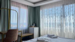 Postel nebo postele na pokoji v ubytování Ora Bella Hotel