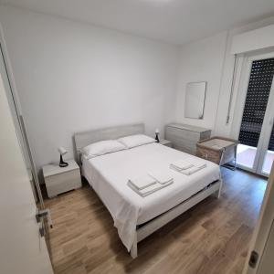 Krevet ili kreveti u jedinici u okviru objekta Appartamento Corallo