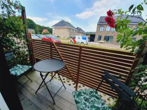 a balcony with a table and two chairs on it at B&B Biej' oons tuus in Hellendoorn