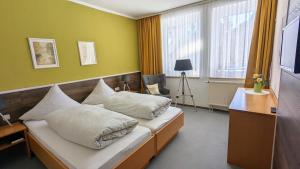 TV a/nebo společenská místnost v ubytování Hotel Heilbrunnen
