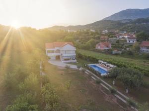 an aerial view of a house with a swimming pool at Villa MontAnja in Herceg-Novi