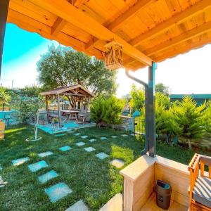 a backyard with a gazebo and a playground at Nur Konak daire 3 in Çanakkale