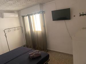 Rúm í herbergi á Apartamento Tirant lo Blanc