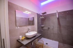 a bathroom with a sink and a shower at Villa Barone in Procida