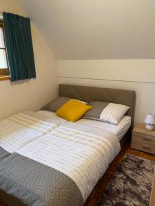 Postel nebo postele na pokoji v ubytování Apartma Trobentica 23 Moravske Toplice