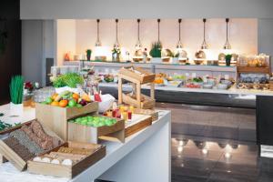 a kitchen with many boxes of food on a counter at Quality Hotel Entry in Kolbotn