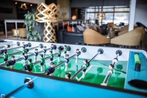 a chess game on a table in a living room at Quality Hotel Entry in Kolbotn