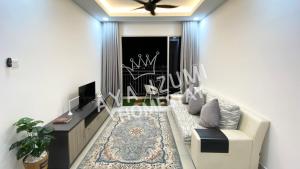 a living room with a couch and a tv at Aya Izumi 3 bed Condo near to Bangi Wonderland in Kajang