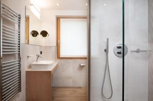 a bathroom with a sink and a shower at Green Rose in Livigno