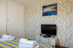 Postel nebo postele na pokoji v ubytování Apartmani Nina