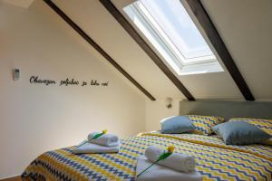 Postel nebo postele na pokoji v ubytování Apartmani Nina