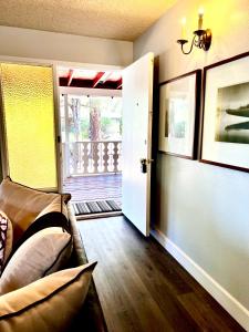 a room with a couch and a door to a porch at Hidden Gem Retreat in the Heart of Payson in Payson
