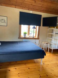 Postel nebo postele na pokoji v ubytování Lillstugan Lyckan