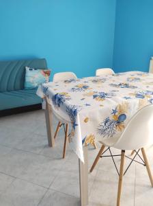 a table with a blue and white table cloth on it at Azzurro come il Mare in Termoli