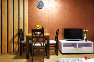 TV a/nebo společenská místnost v ubytování Apartmani Nina