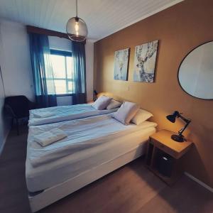 Grindavik Guesthouse self check in & outにあるベッド