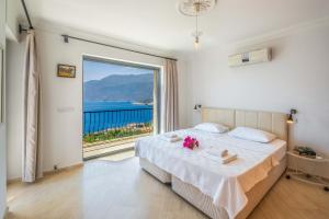 Ένα ή περισσότερα κρεβάτια σε δωμάτιο στο Villa Fortuna Sunset 1