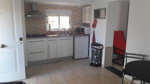 Kuchyň nebo kuchyňský kout v ubytování casadelfenix