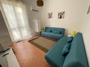 A seating area at Casa vacanze Baglio Barcellona Mondello