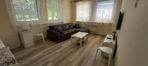 A seating area at Hotel Pod Šaumburkem