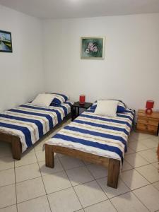 Postel nebo postele na pokoji v ubytování Apartments Mašić